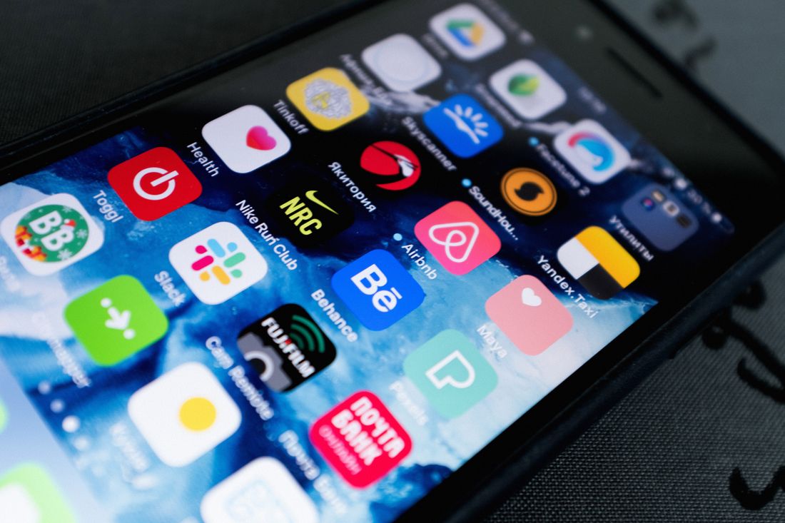 Mobile app interface being tested on a phone